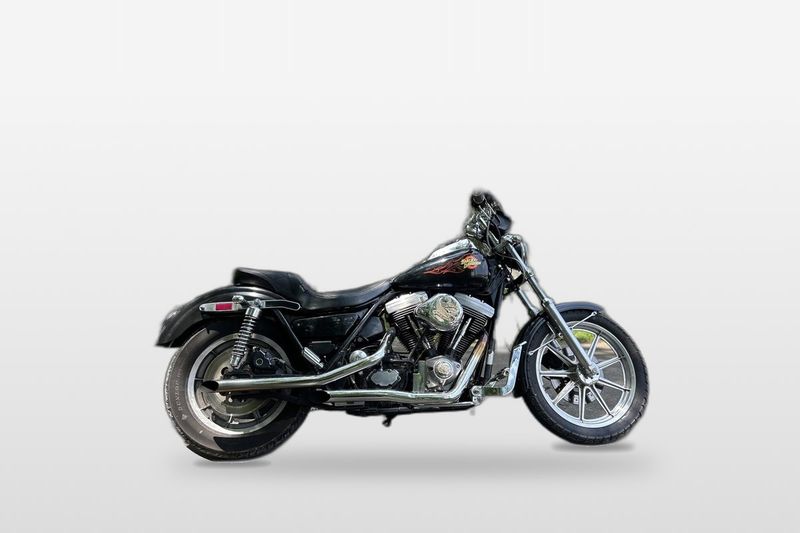 A black 1985 FXRS on a plain grey backdrop. Not the bike for sale.