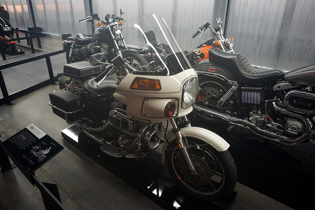 A white 1984 Harley-Davidson FXRP police motorcycle with fairing on display at the Harley-Davidson Museum